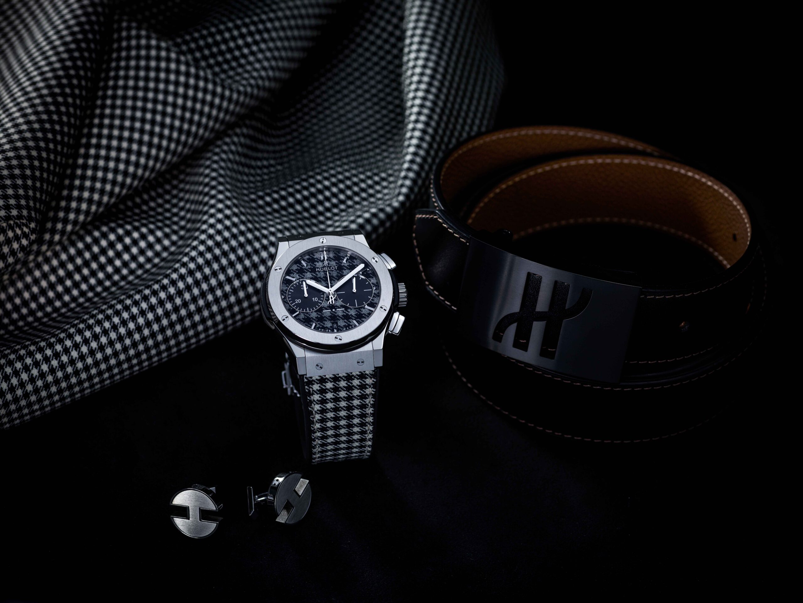 HUIBLOT TIMEPIECE LIFESTYLE IMAGE WITH BELT AND CUFFLINKS