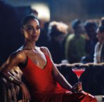 Zoe Saldana plays Mia Parc in the Campari Red Diaries Legend of Red Hand short movie, pictured wearing Fendi Red Boots and Vhernier Plissé bracelet in satin rose gold, with a Shaken Campari cocktail. Image by Matteo Bottin