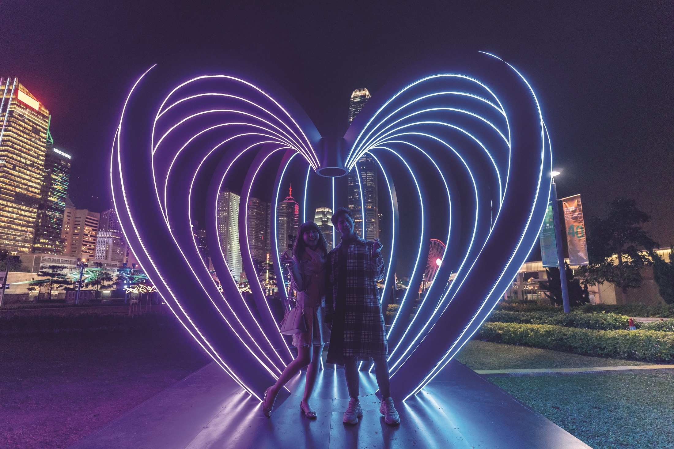 HONG KONG, HONG KONG - JANUARY 17: Models poses in front of the Capture installation at the Hong Kong Pulse Light Festival International Light Art Display on January 17, 2019 in Hong Kong, Hong Kong. (Photo by Anthony Kwan/Getty Images for Hong Kong Tourism Board)